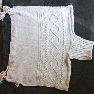 Serra 100% polyester grey knit turtle neck poncho with tassles